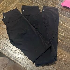 LULU LEMON: 3 Pairs of Lulu lemon black high waisted leggings.
